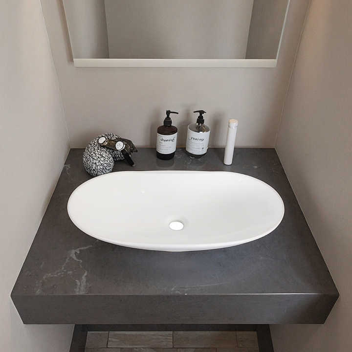 Chậu rửa mặt hình bầu dục hiện đại Lavabo bằng gốm sứ đặt trên mặt bàn chậu rửa mặt phòng tắm