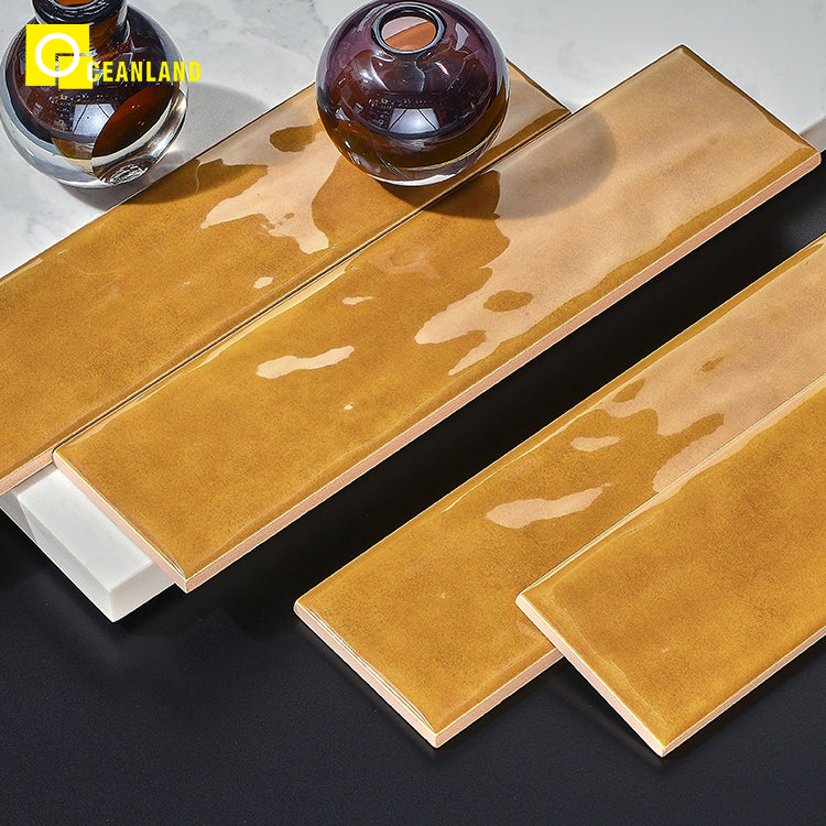 Gạch ốp tường 75x300 hình chữ nhật kiểu gạch thẻ, bề mặt bóng có kết cấu, dùng cho phòng tắm và bếp.