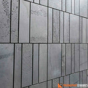 Đá ốp tường ong xám mix 101530×60